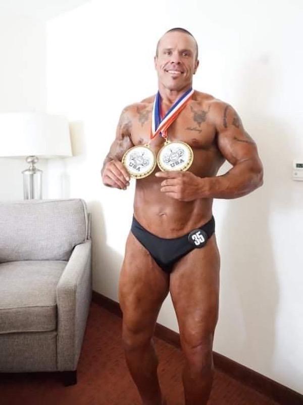 Colby showing off his awards